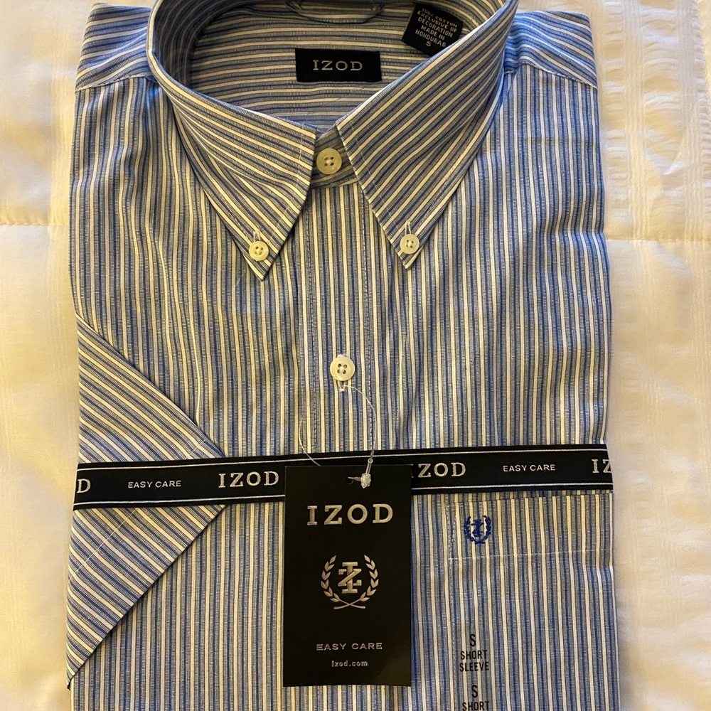 Never been opened. New Izod short-sleeve with tags and logo ribbons. Size Small